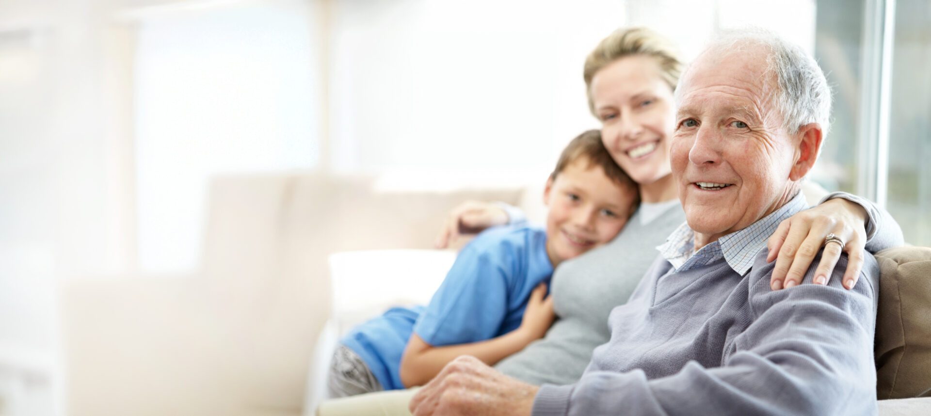 Senior man sitting with his daughter and grandson