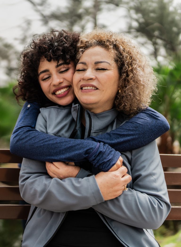 Mother and daughter embraced on the public park