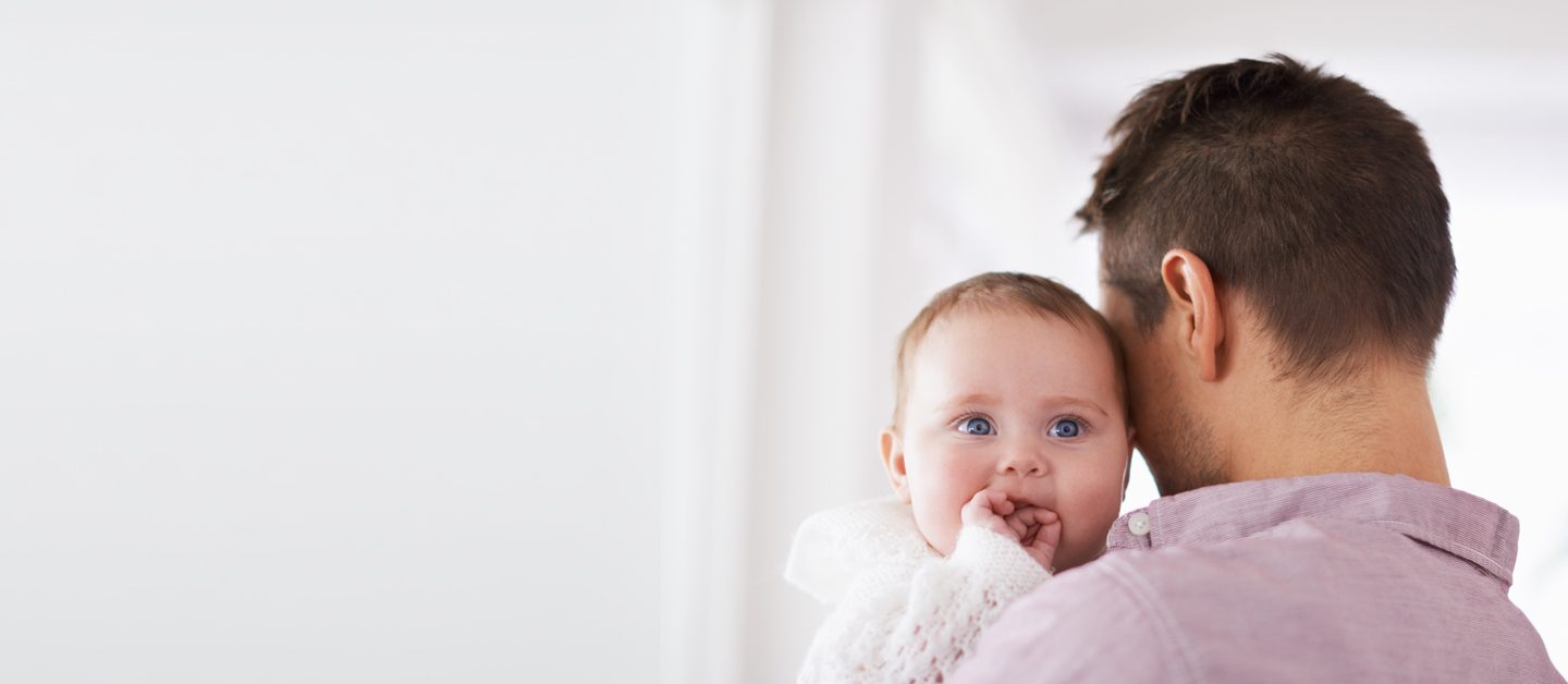 Man and baby hugging