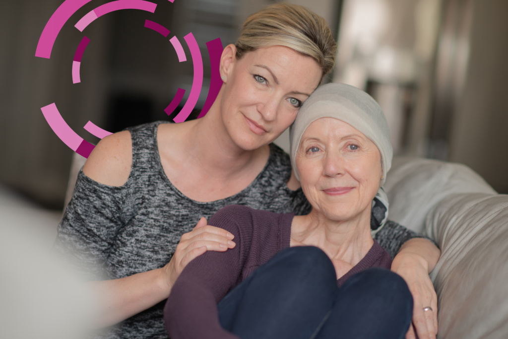An Elderly Oncology Patient Shares an Embrace with Her Daughter stock photo